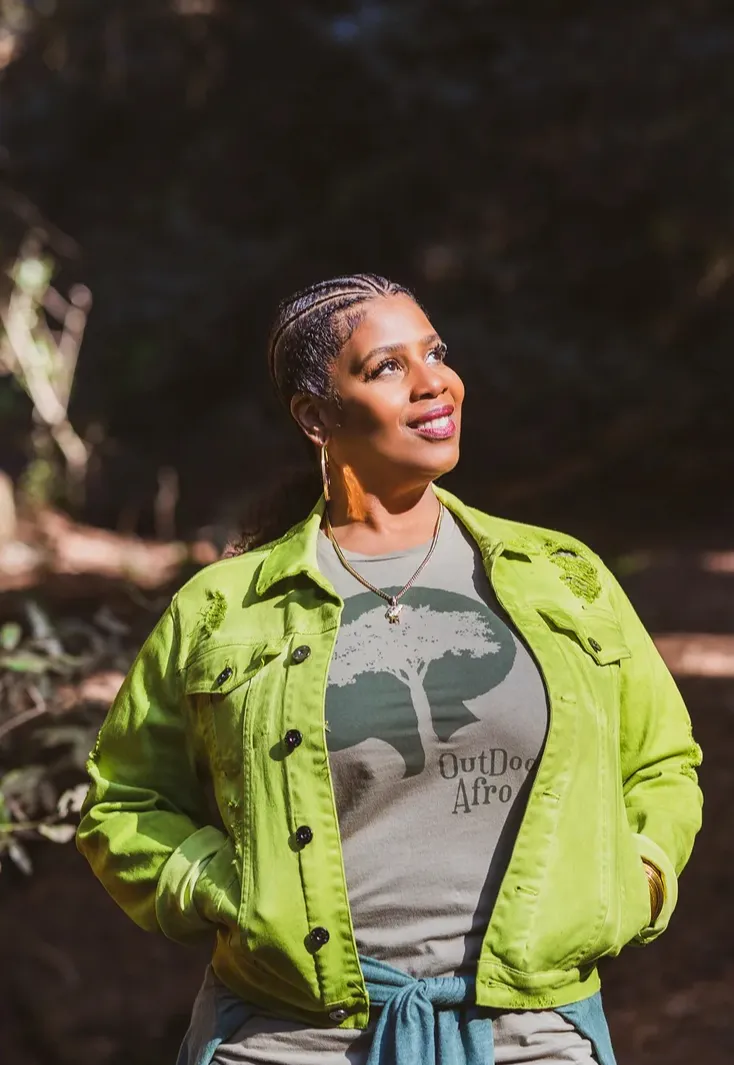 Rue Mapp in a bright green jacket outdoors